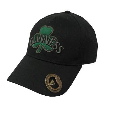 black peaked cap with green shamrock motif and bottle opener